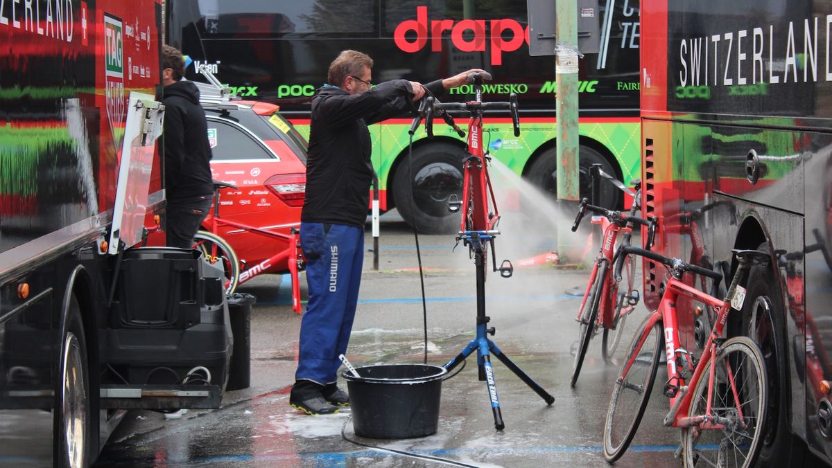The BMC mechanics wash down the bikes