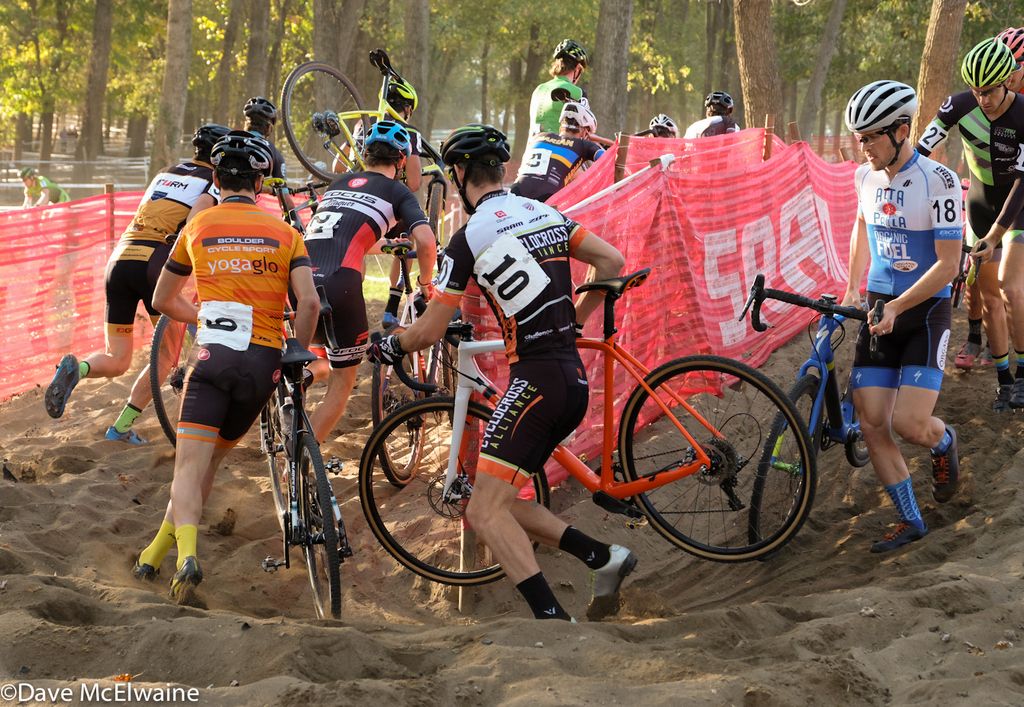 Allen Krughoff (Boulder Cycle Sport) and Andrew Dillman (Cyclocross Alliance) round the 180-degree turn in the sand pit