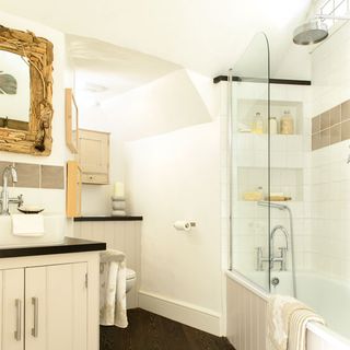 white bathroom with bathtub and washbasin