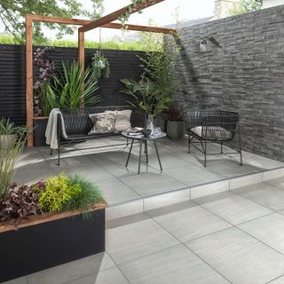 extra large grey tiles from Topps Tiles in modern patio scene