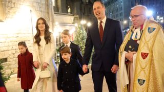 Princess Charlotte of Wales, Catherine, Princess of Wales, Prince Louis of Wales, Prince George of Wales, Prince William, Prince of Wales and The Dean of Westminster Abbey, The Very Reverend Dr David Hoyle attend The "Together At Christmas" Carol Service