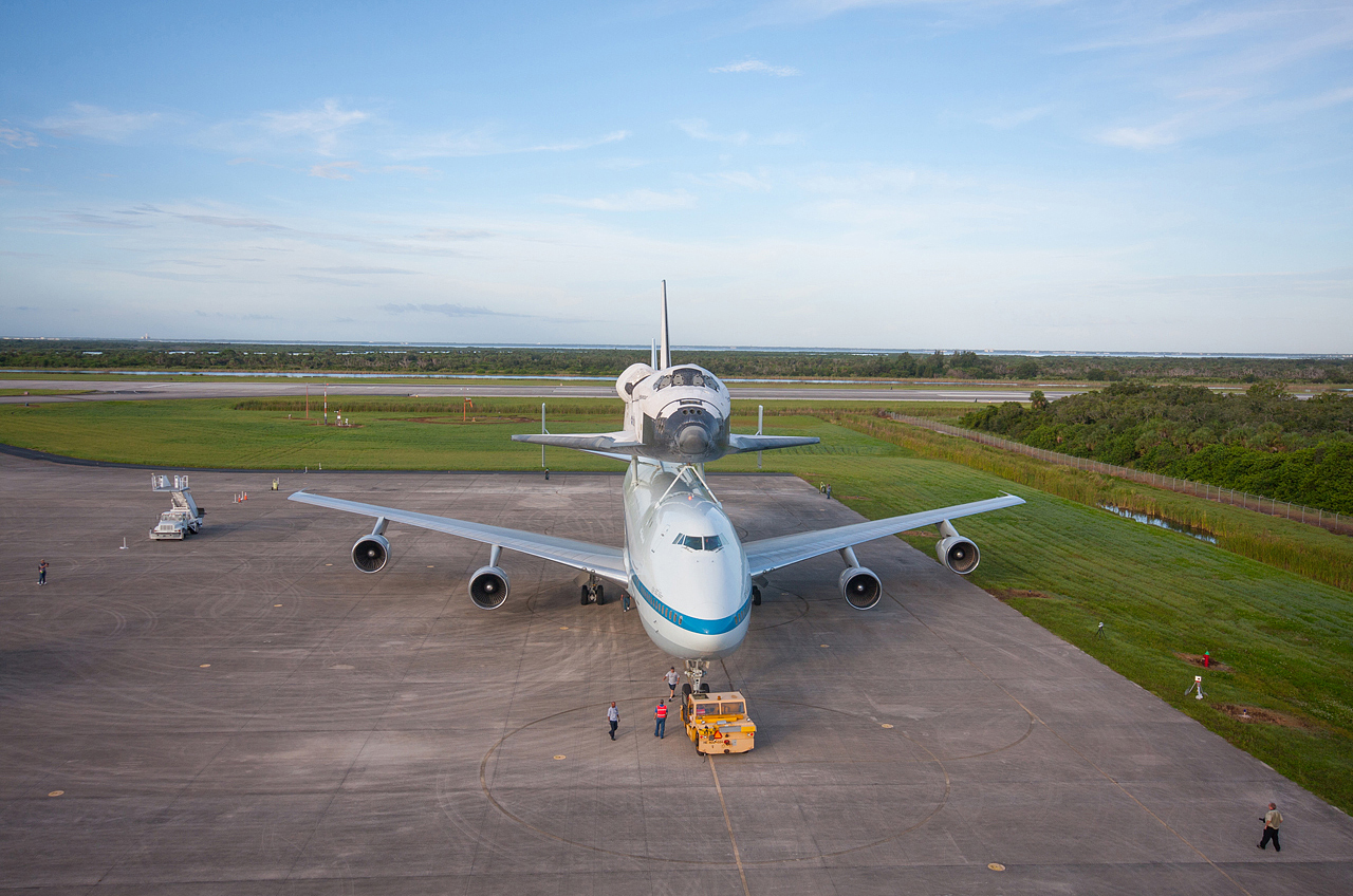 NASA&#039;s Shuttle Carrier Aircraft (SCA) is parked on the apron of the Shuttle Landing Facility at the Kennedy Space Center in Florida with space shuttle Endeavour secured on its back on Sept. 16, 2012. 