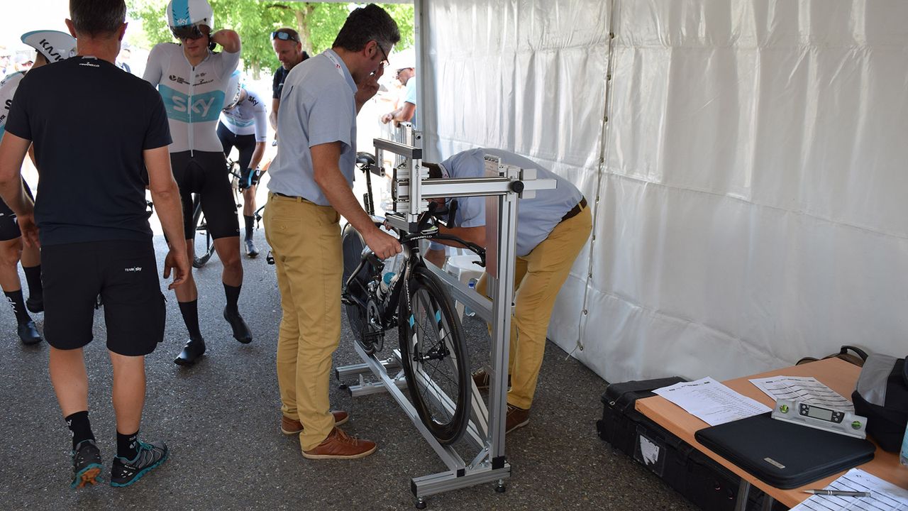 Each rider's bike is checked by UCI commisaires with a jig to ensure sizing regulations are met