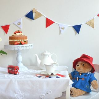 coronation decoration bunting with red, white, blue and gold flags