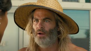 Chris Pine looking confused while wearing a sunhat in the trailer for Poolman.