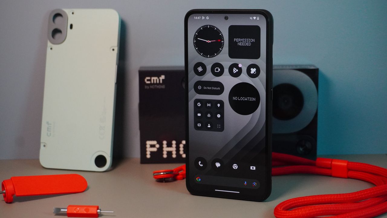 The CMF Phone (1) surrounded by some of the accessories for the phone