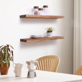 Two floating wood shelves in a kitchen's dining area