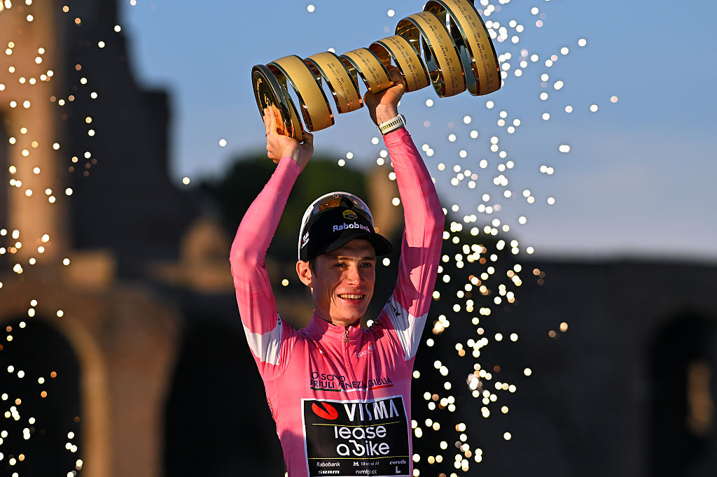  Jonas Vingegaard of Denmark and Team Visma | Lease a Bike celebrates at podium as Pink Leader Jersey and overall race winner with the Trofeo Senza Fine during the 109th Giro d'Italia 2026