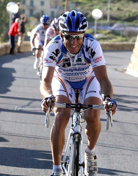 Bertolini seems to smile but it was more a grimace as he tried to go solo on the Poggio.