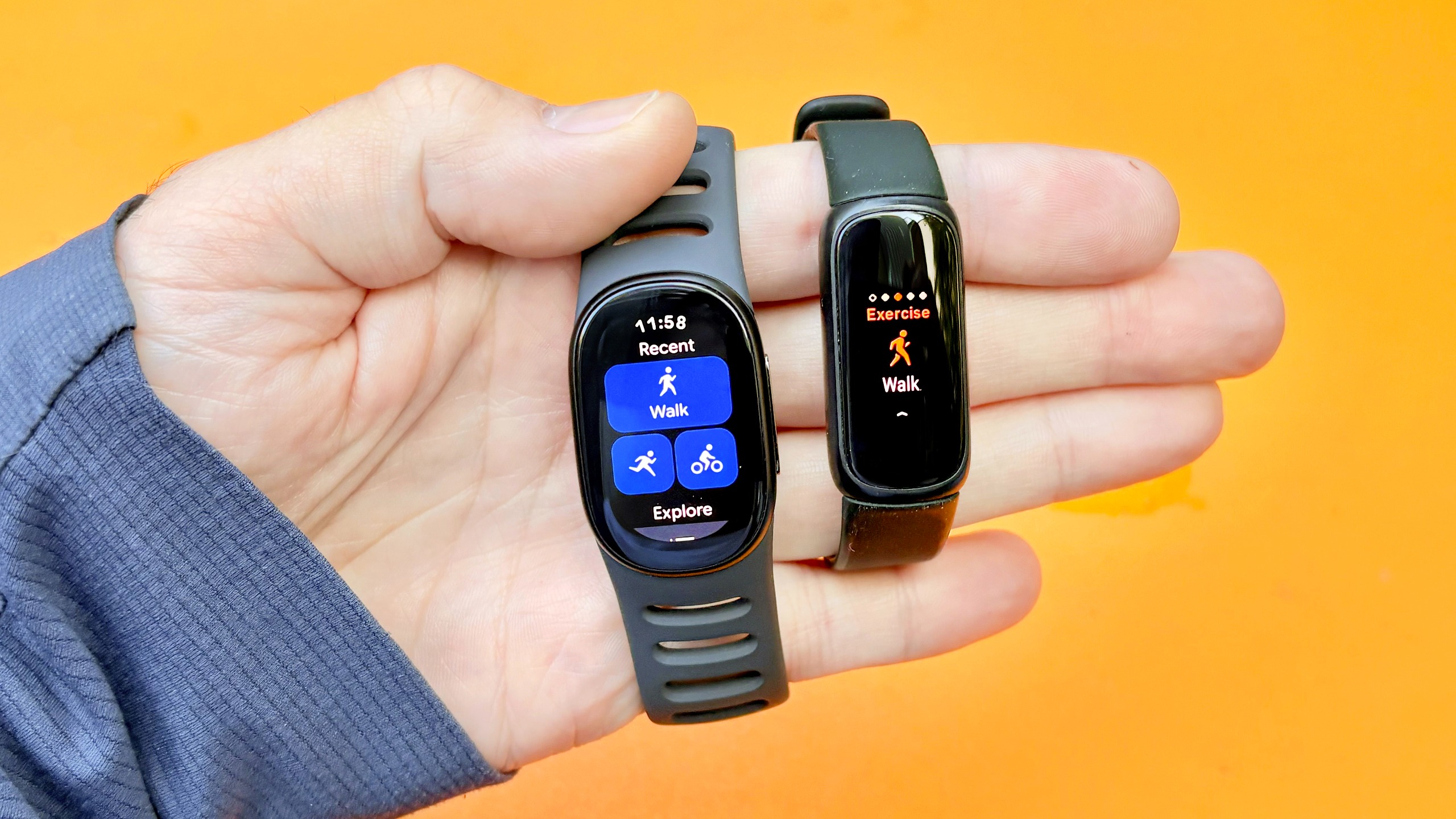Close-up of the Fitbit Edge next to the Fitbit Inspire 3