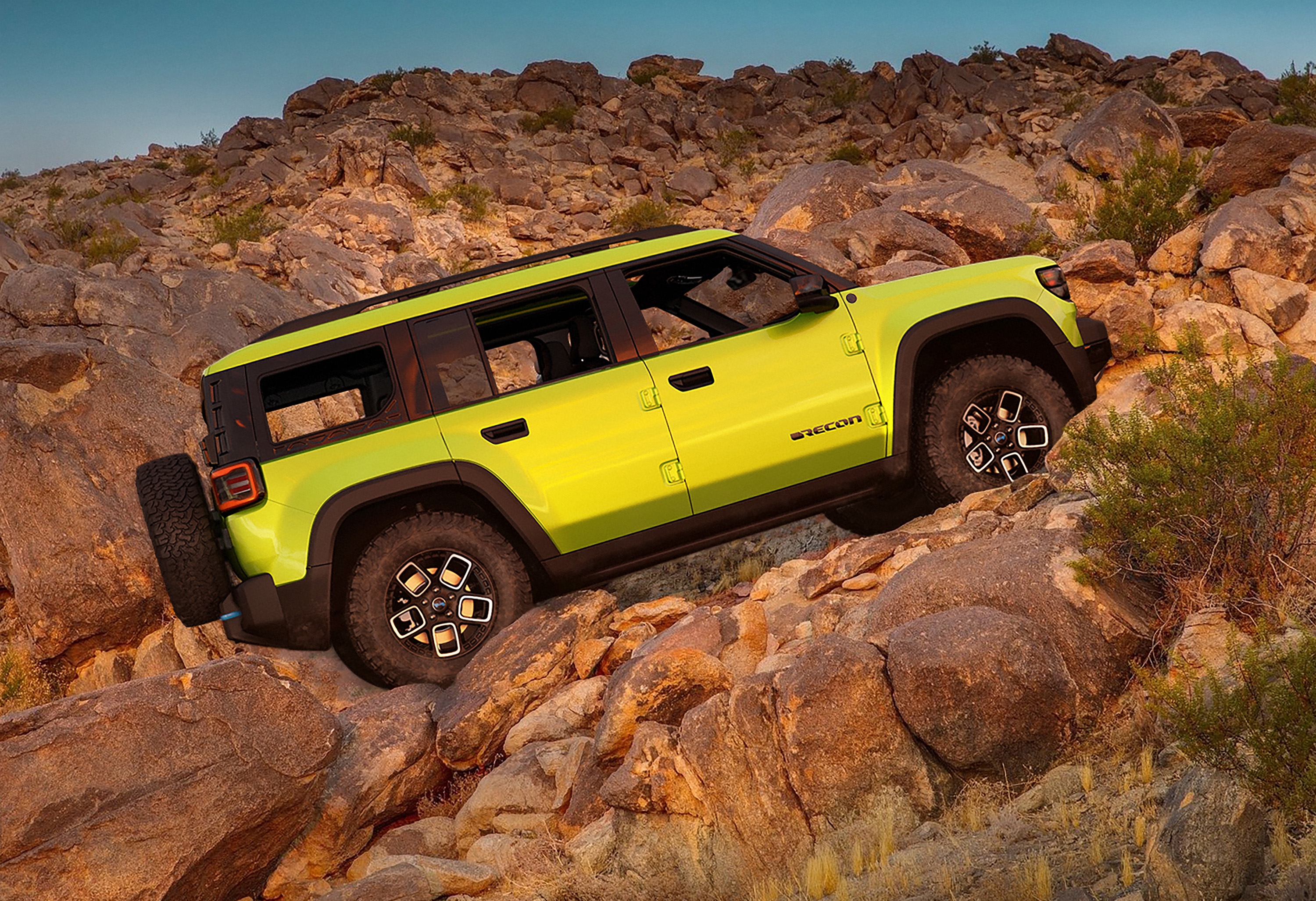 yellow jeep recon going off road