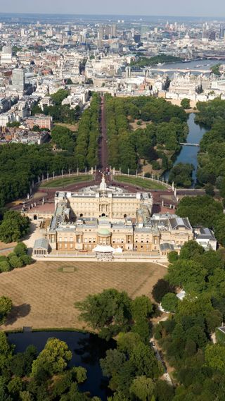 An aerial shot of Buckingham Palace and its surrounding gardens