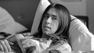 Singer David Surkamp of Pavlov's Dog relaxes in his hotel room, Los Angeles, CA 1975.