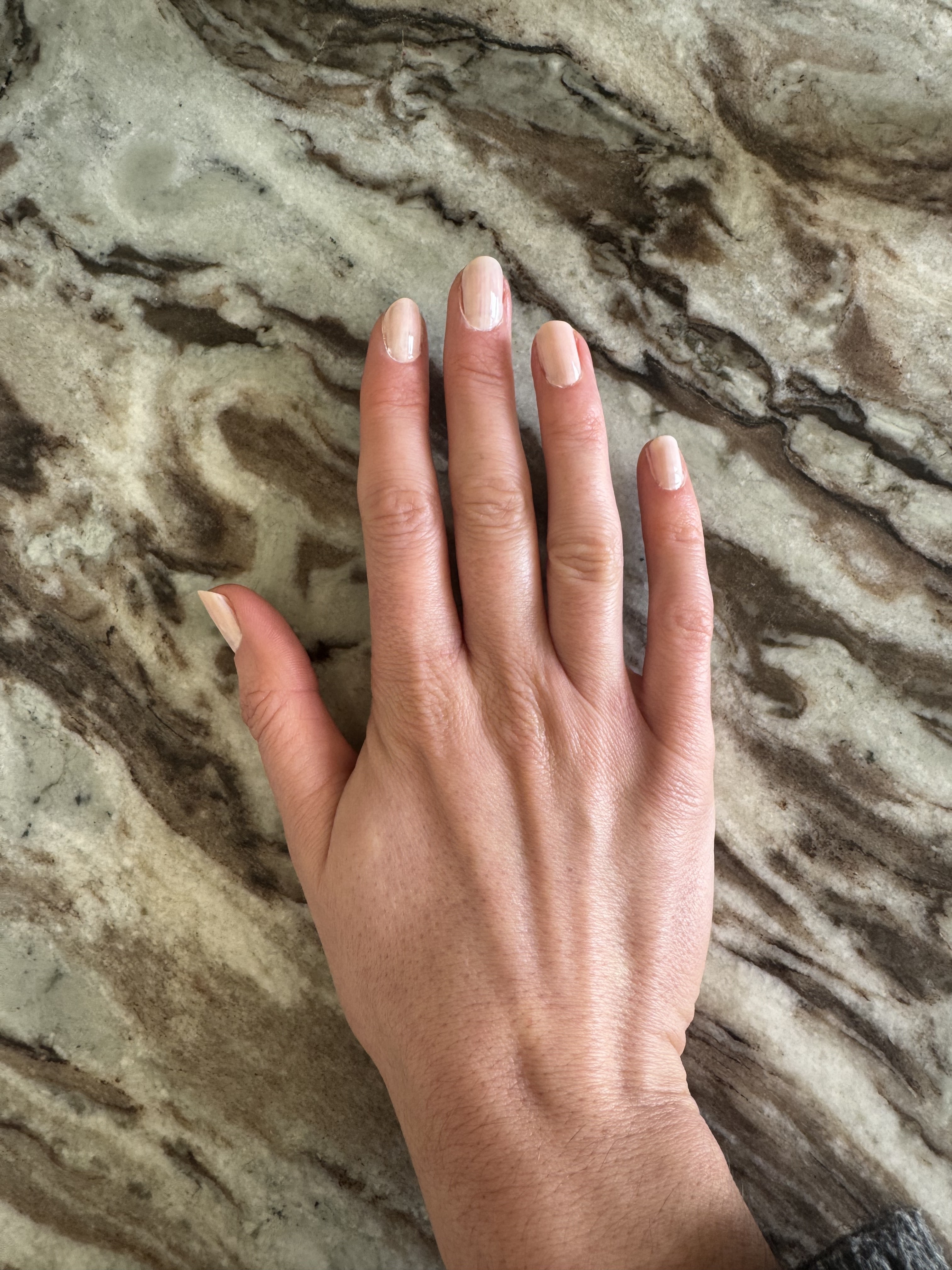 Eleanor's hands with two coats OPI Funny Bunny and one Coat Bubble Bath nail polishes