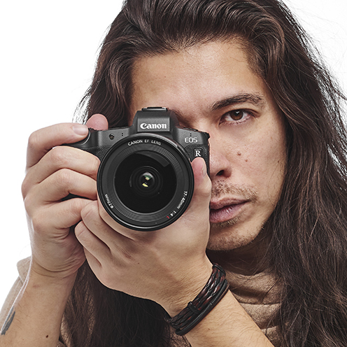 Photographer James Artaius holding a Canon EOS R camera