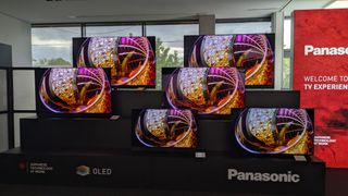 Panasonic 2025 OLED TVs all displaying a colored glass