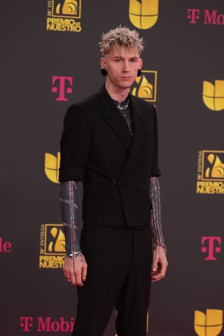 MGK standing on the red carpet