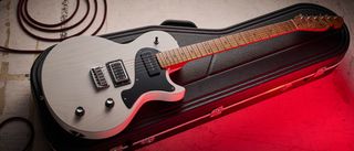 PJD Carey Classic: the translucent white singlecut has a handsome roasted figured maple neck, a black pickguard, and a P-90/Humbucker pairing.