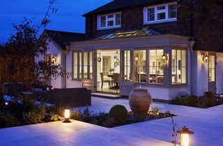 conservatory at night with outdoor lighting
