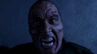 Dwayne Johnson, as a zombie, screams directly into the camera.