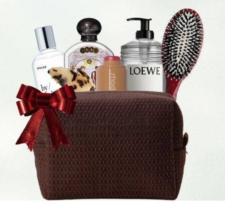 a makeup bag for your sister in law filled with beauty gifts on a green and blue background