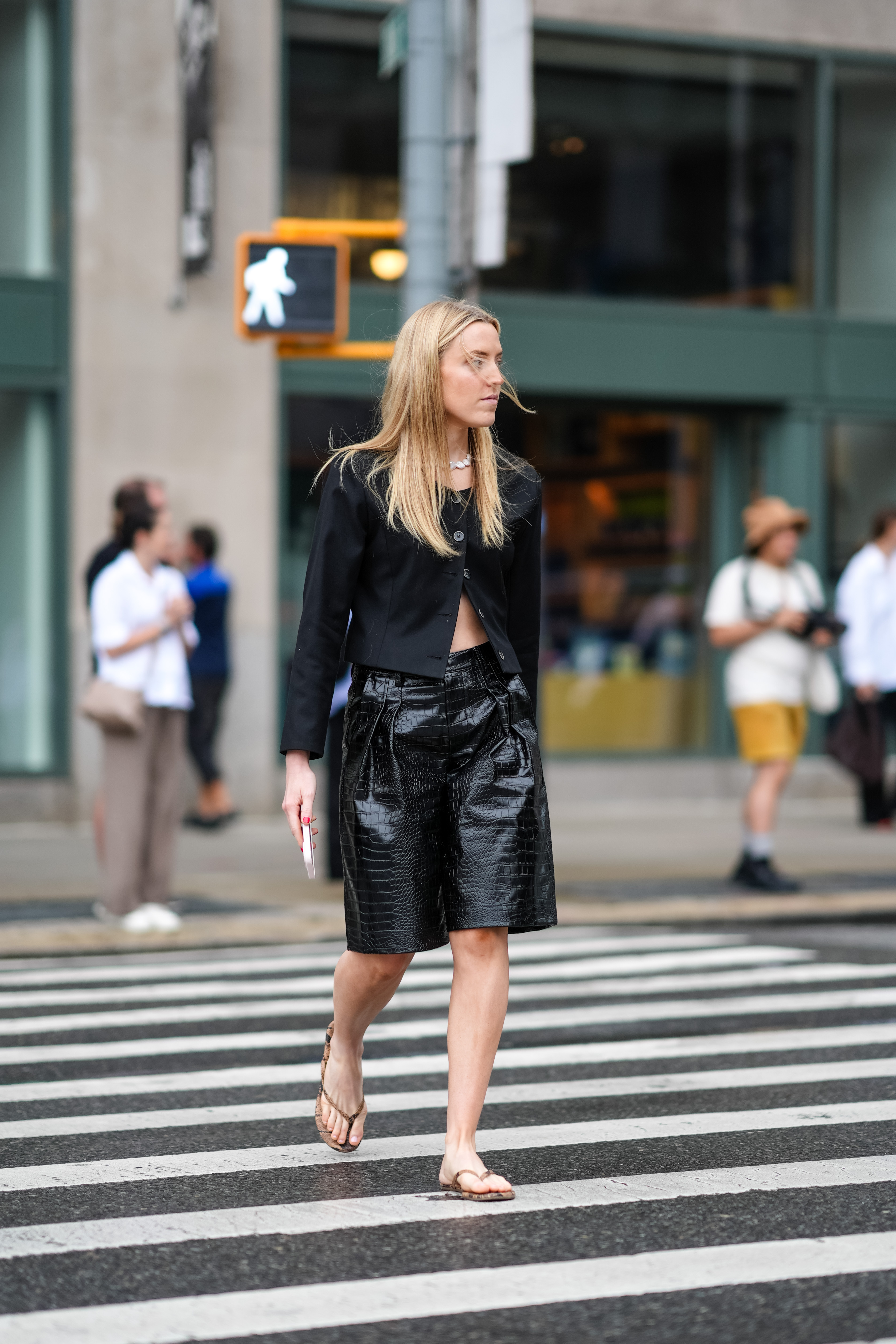 woman wearing shorts and a cardigan