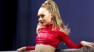 Maddie Ziegler in the group dance "Bittersweet Charity"