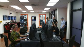 Nvidia's Tom Petersen (foreground), AMD's Omar Faiz (seated on right), Nvidia's Joe Vivoli (standing), Chris Angelini (standing, hatted).