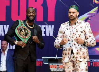 Deontay Wilder (l.) and Tyson Fury at a Los Angeles press conference to promote their Feb. 22 pay-per-view fight, co-promoted by ESPN and Fox Sports.