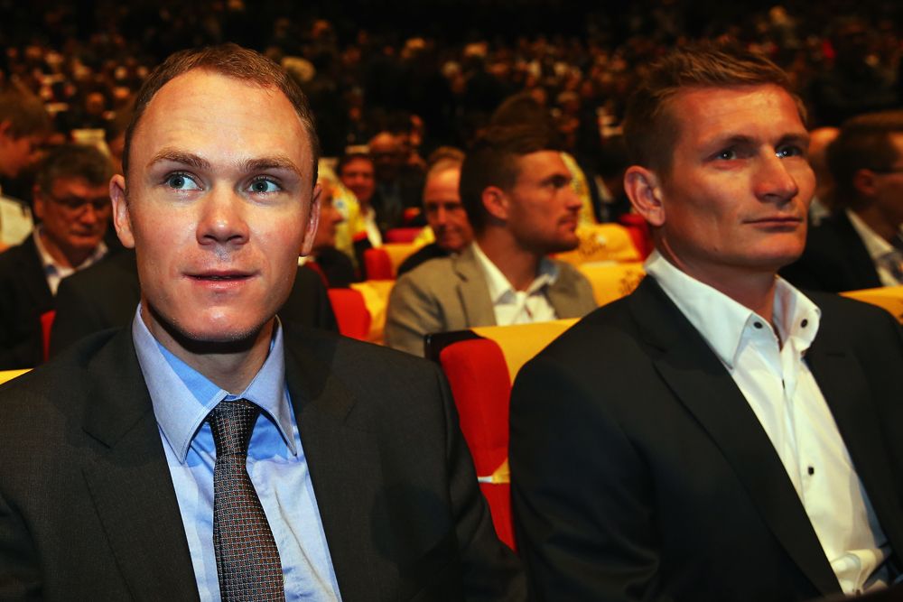 Defending champion Chris Froome sitting next to Andre Greipel