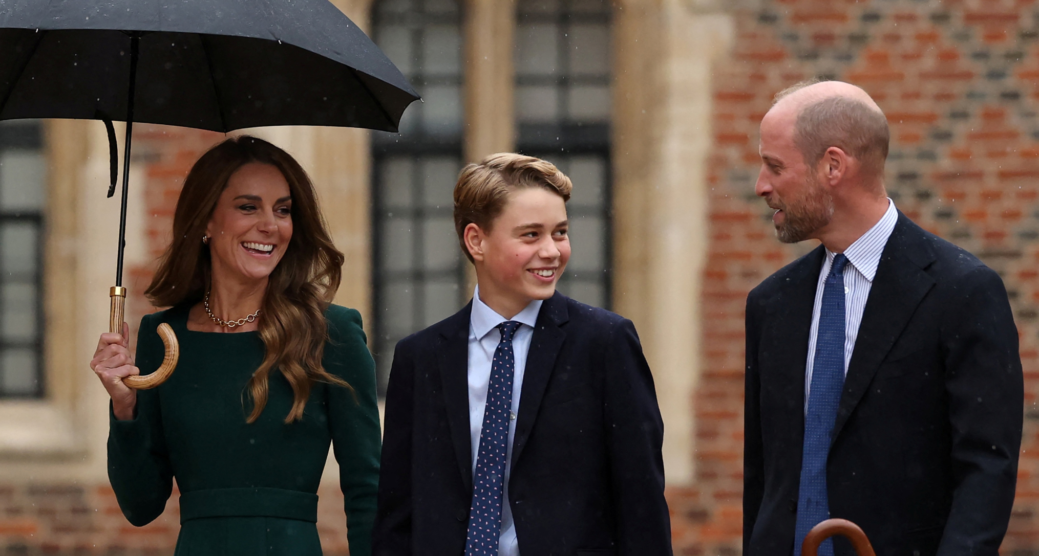 Princess Kate, Prince William and Prince George walking into Eton College