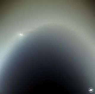 Saturn's moon Enceladus is visible through its E Ring in this composite of images taken by NASA's Cassini spacecraft on July 19, 2013.