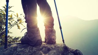 best hiking boots: hiking boots and sunrise