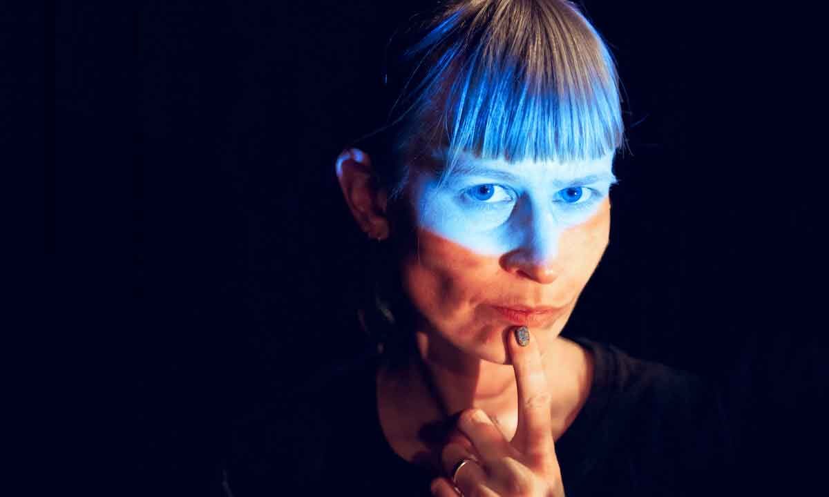 Jenny Hval against a black background