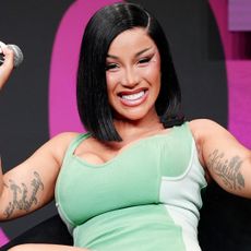 Cardi B wore the peep-toe boots trend while filming her music video in NYC