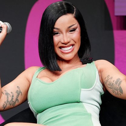 Cardi B wore the peep-toe boots trend while filming her music video in NYC