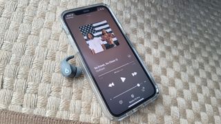 The Beats Fit Pro playing music on Apple Music