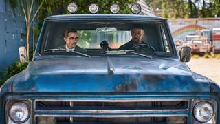 Dave Franco and Jamie Foxx in a blue truck in Day Shift - Is Big John a vampire in Day Shift?