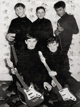 Higgins, centre back row, with Lynott and pals.