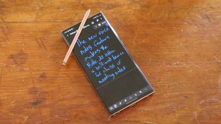 Samsung Galaxy Note 20 Ultra with S Pen resting on it