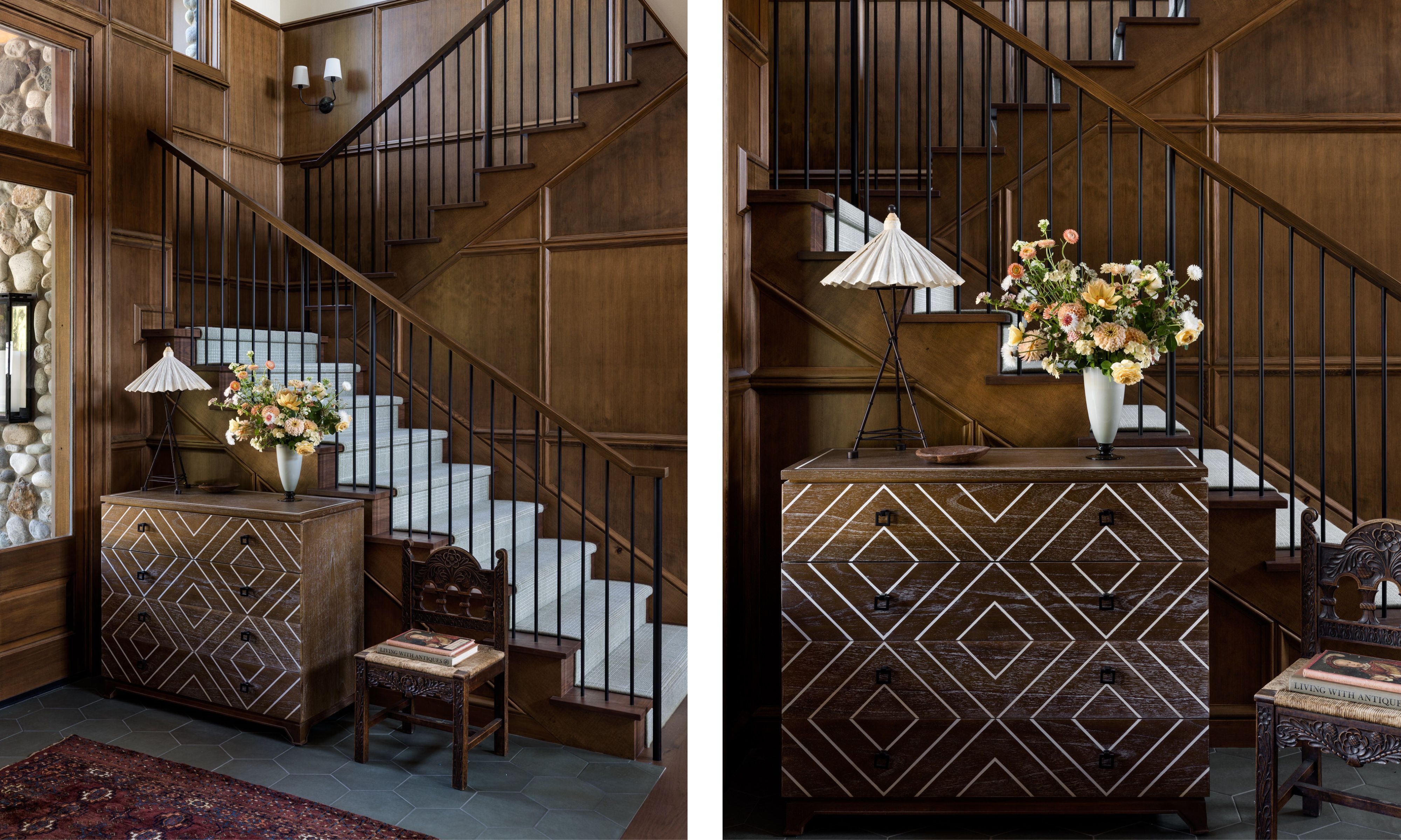 Two images of an entryway with dark wood paneling on the staircase, a pale green stair runner, a wooden dresser with a geometric pattern, and gray flooring.