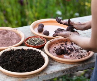 making seed bombs on a bench