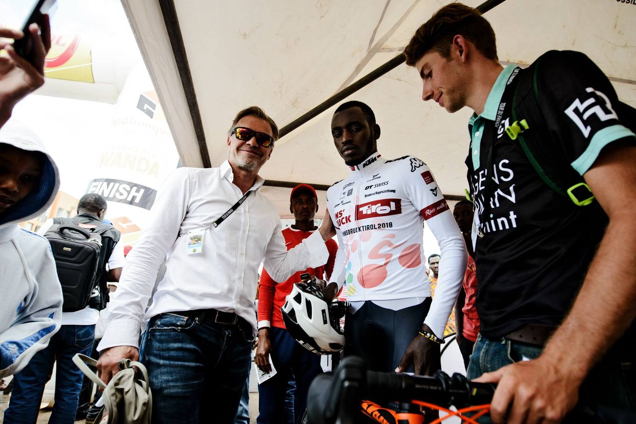 Tirol team manager Thomas Pupp with Valens Ndayisenga at the Tour of Rwanda