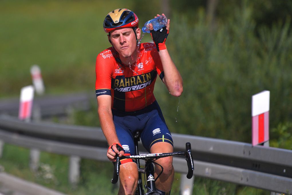 Matej Mohoric cools himself while riding to the finish of stage 7 at the 2019 Tour de Pologne