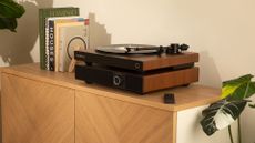 Victrola Wave turntable sitting on top of Soundstage speaker unit