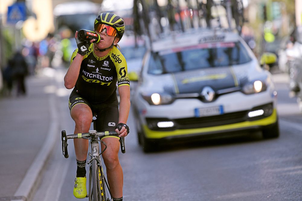 Annemiek Van Vleuten hydrates as she rides to the finish of Strade Bianche