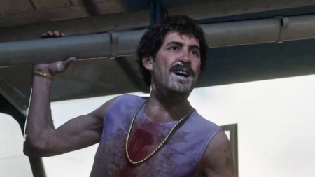 Man covered in blood smiles