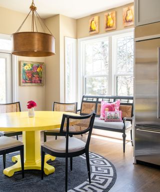 60s style dining room with a bold yellow table