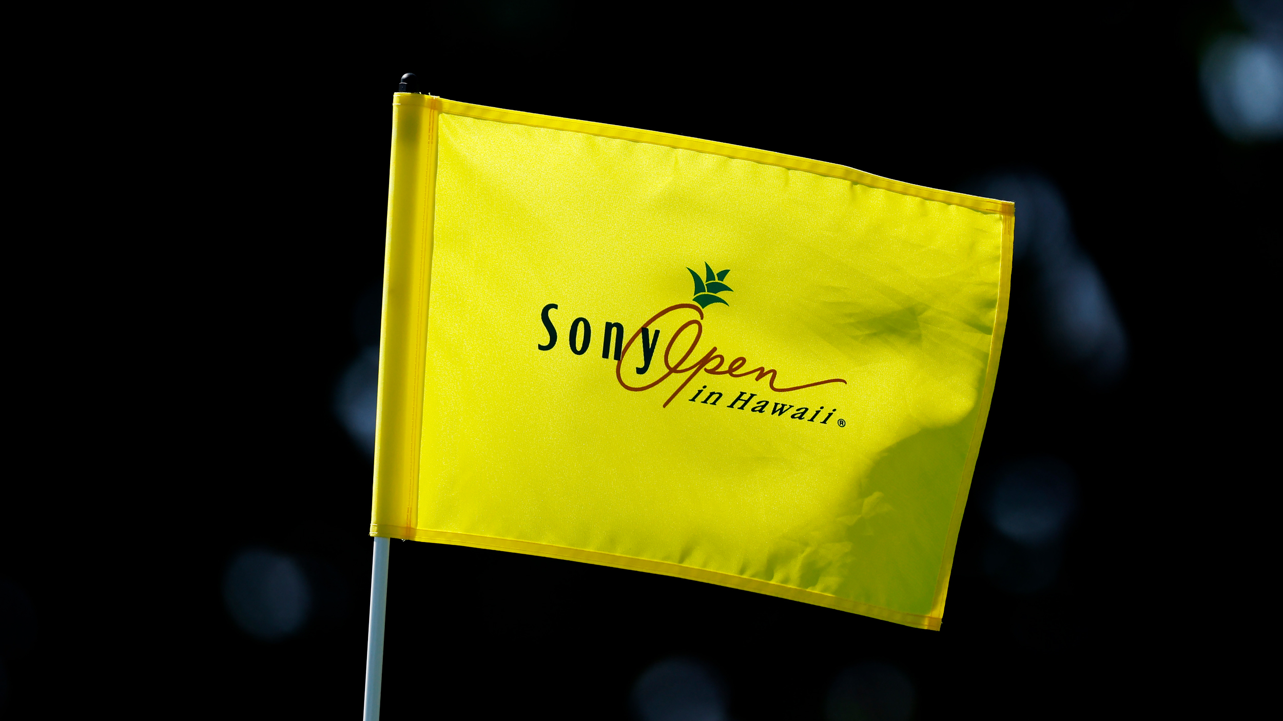 A yellow Sony Open in Hawaii PGA Tour flag 