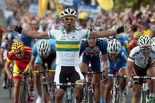 Golden bling: Michael Matthews from Australia begins his celebrations in Geelong and the gold medal in the men's under 23 road race.